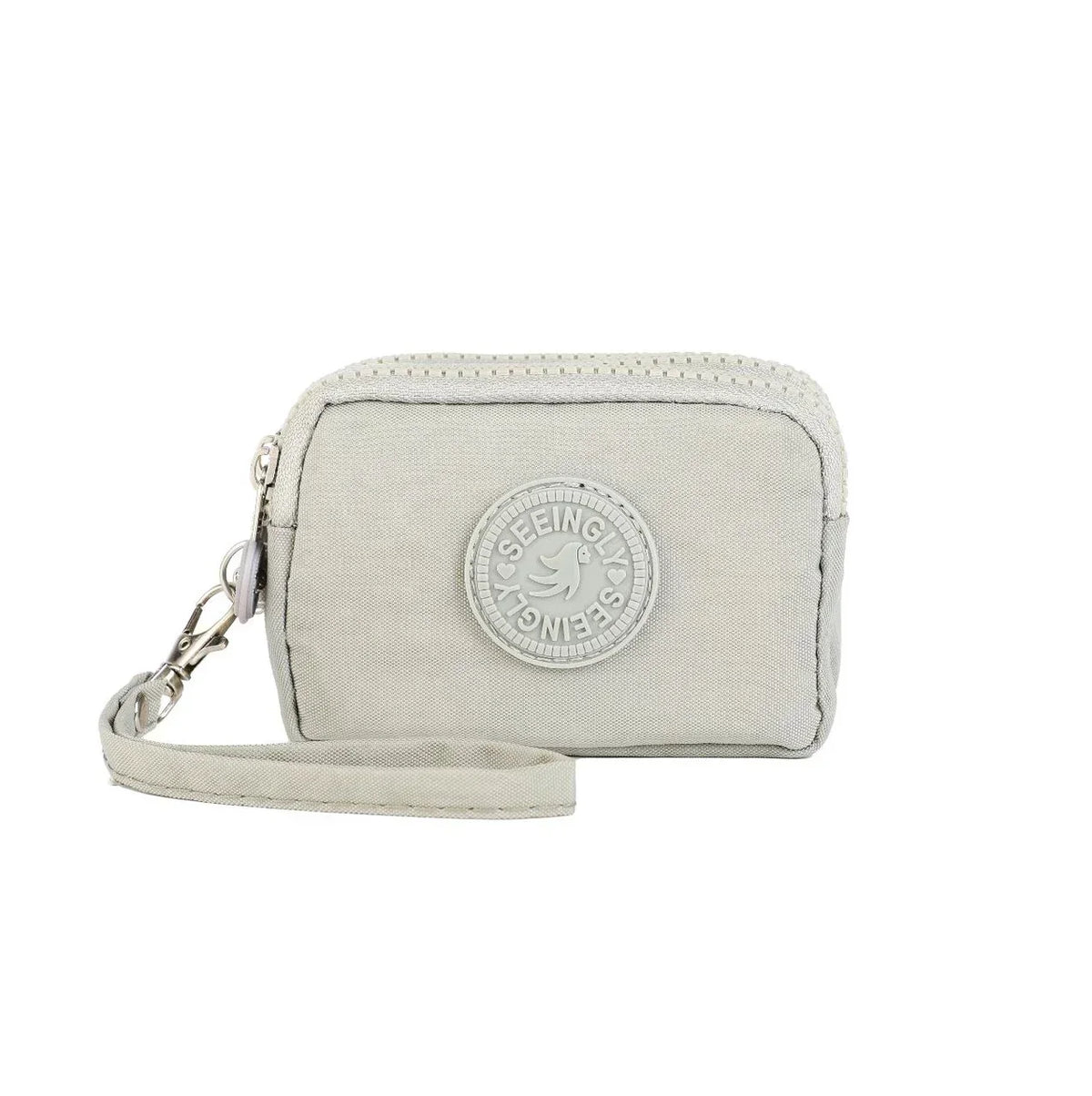 A light beige compact three-layer nylon zipper pouch with a circular logo on the front and a leather strap attached.