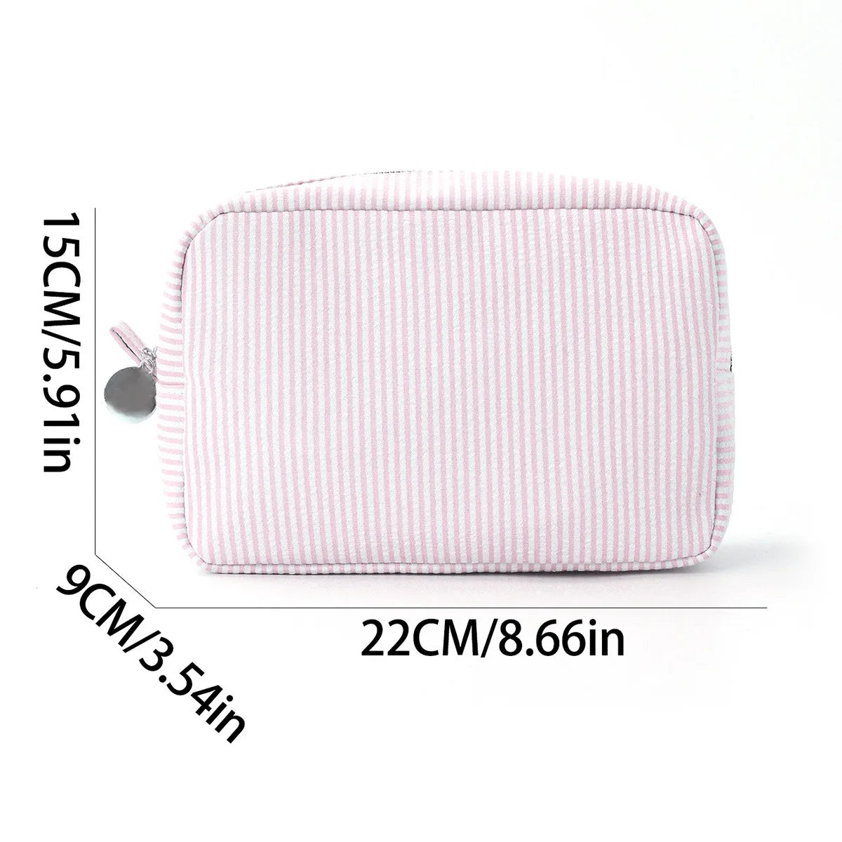 A pink seersucker striped cosmetic bag with a zipper closure shown flat.