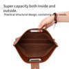 A brown leather laptop briefcase with a flap closure is shown being held by a hand.