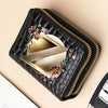 A black PU leather double-zip clutch wallet featuring a gold-toned geometric design and floral print.