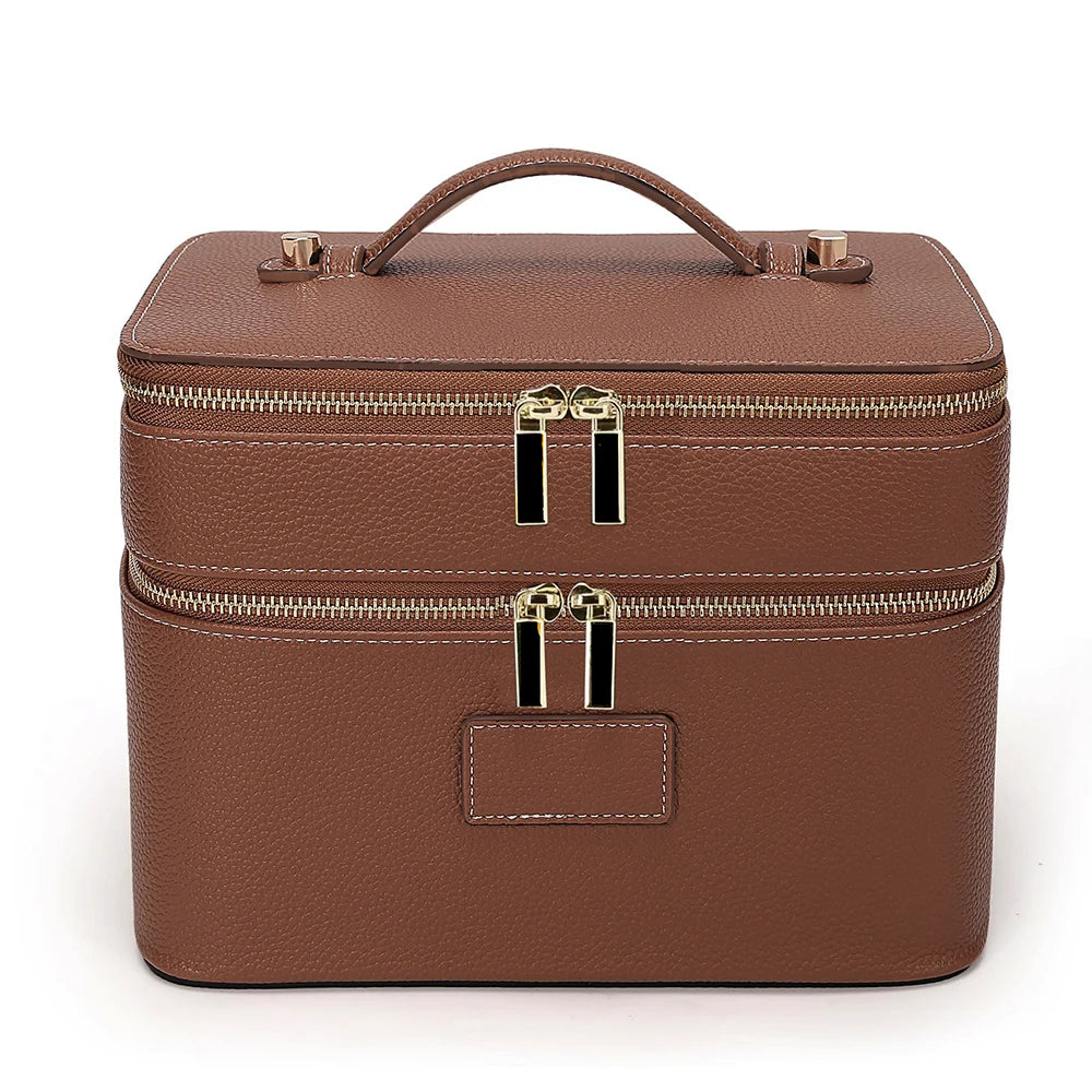 A brown double-layer makeup storage case with a leather handle and gold zippers.
