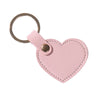 A pink leather heart shaped keychain with a silver ring.