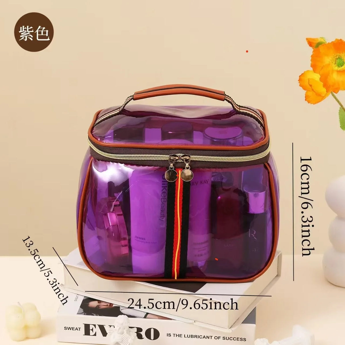 A purple waterproof travel toiletry bag with a brown handle and black zipper is shown on a white box.