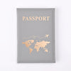 A grey leather passport holder with gold foil printing of the world map and the word PASSPORT.