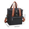 Bolso térmico negro para picnic con correas y bolsillos marrones.