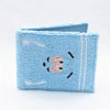 Light blue embroidered fabric wallet with a stitched design on the front