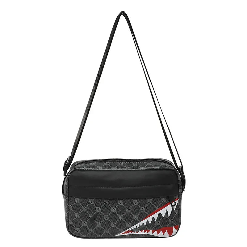 Black crossbody coin purse and mobile phone bag with a gray geometric pattern and red accents