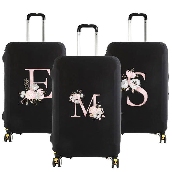 Black luggage with a pink floral design featuring the letters E and M