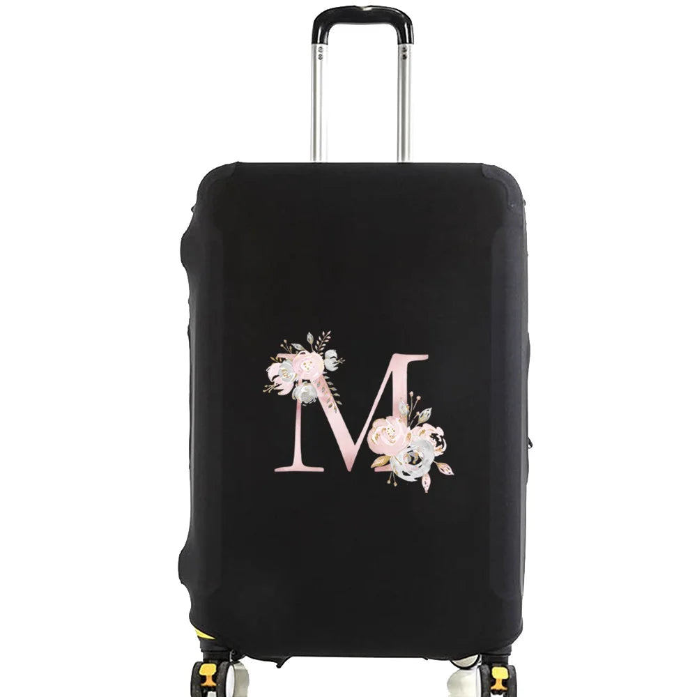 Black luggage protector cover with a large pink floral monogram on the front