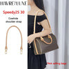 A brown genuine vachetta leather shoulder strap for a dark brown handbag.