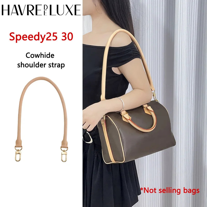 A brown genuine vachetta leather shoulder strap for a dark brown handbag.