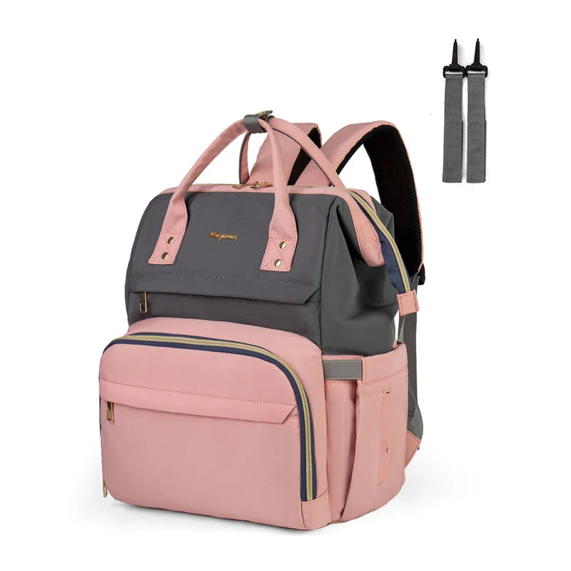 Rosa und graues Muttermilch- und Stilltasche mit befestigten Riemen.