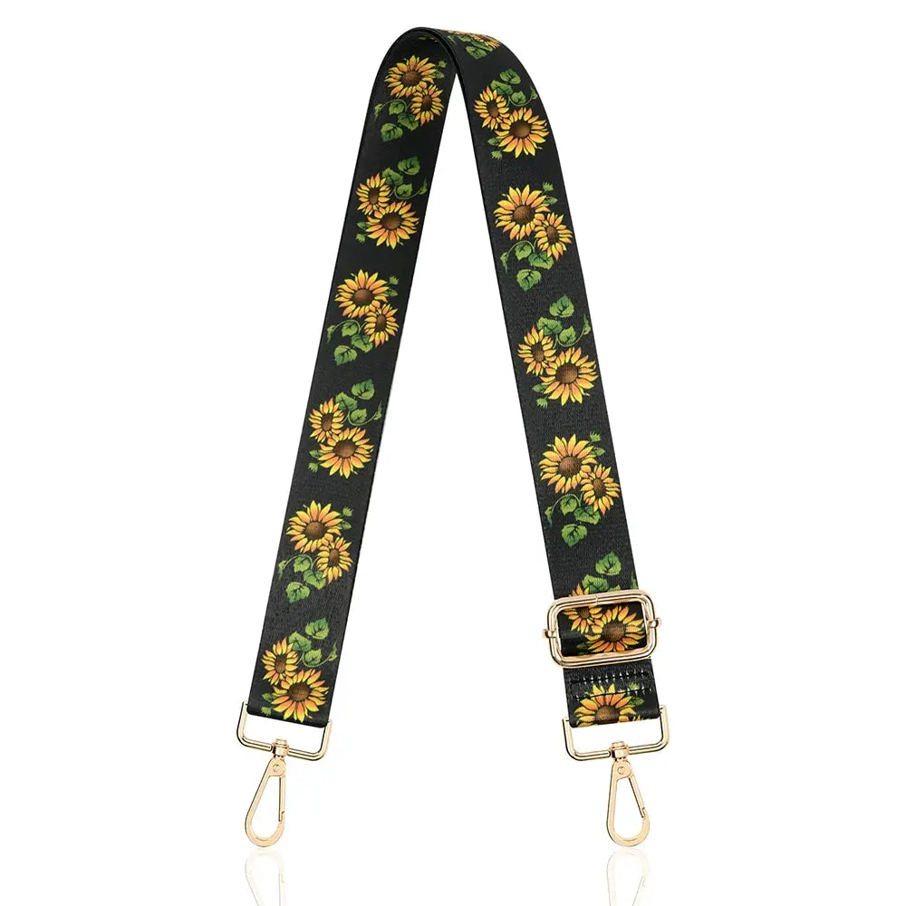 Black nylon crossbody bag strap with a yellow sunflower pattern and gold-tone hardware