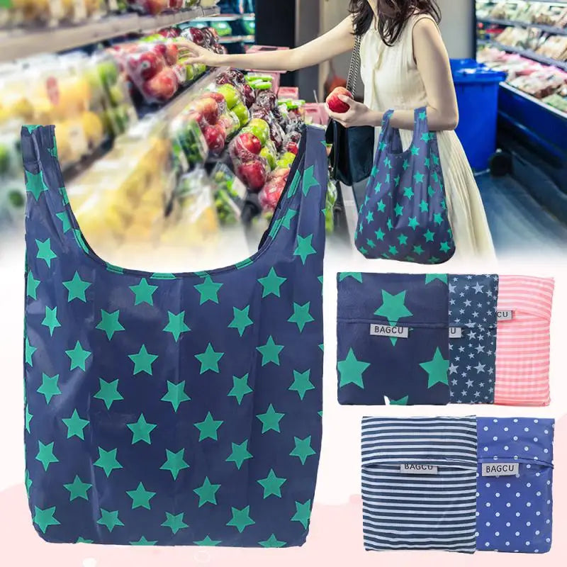 A dark blue reusable shopping bag with green stars is shown in a vertical layout.