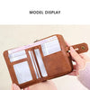 A brown RFID shielded bi-fold wallet with a zipper closure is shown in various displays.