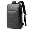 A dark gray laptop backpack with a black strap and a USB charging port.