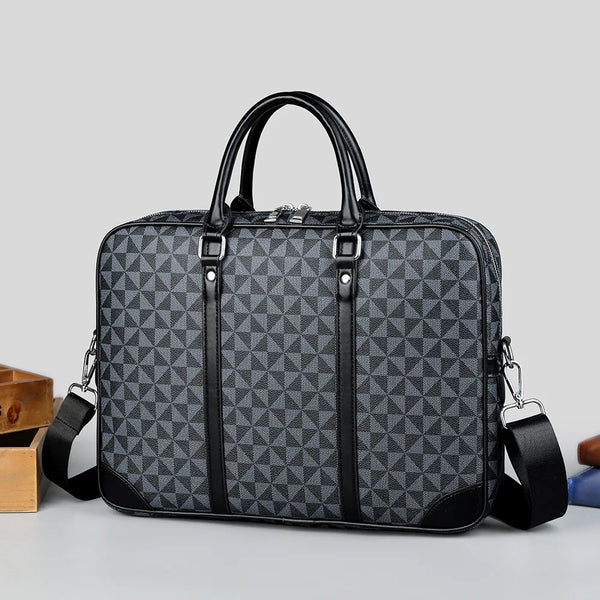A dark gray luxury PU leather business briefcase with black trim and a handle is shown on a light surface.