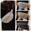A silver rhinestone-embellished crossbody waist bag shown in various angles against a black background.