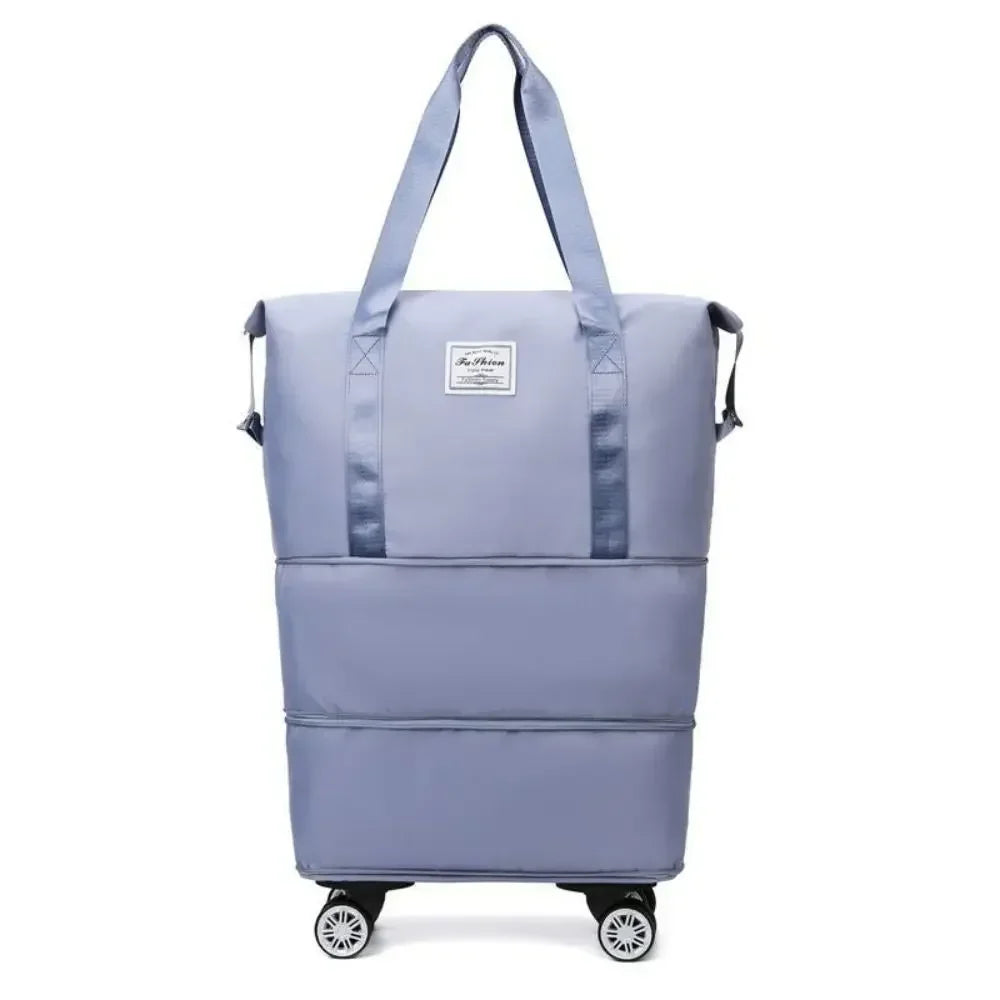 Pochette de voyage multi-usage bleu clair extensible avec poignée et roues.