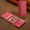 A red leather multi-card wallet with a phone grip stand is shown on a brown surface.