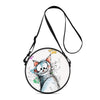 A round cartoon cat crossbody bag with a black strap and watercolor-style artwork.