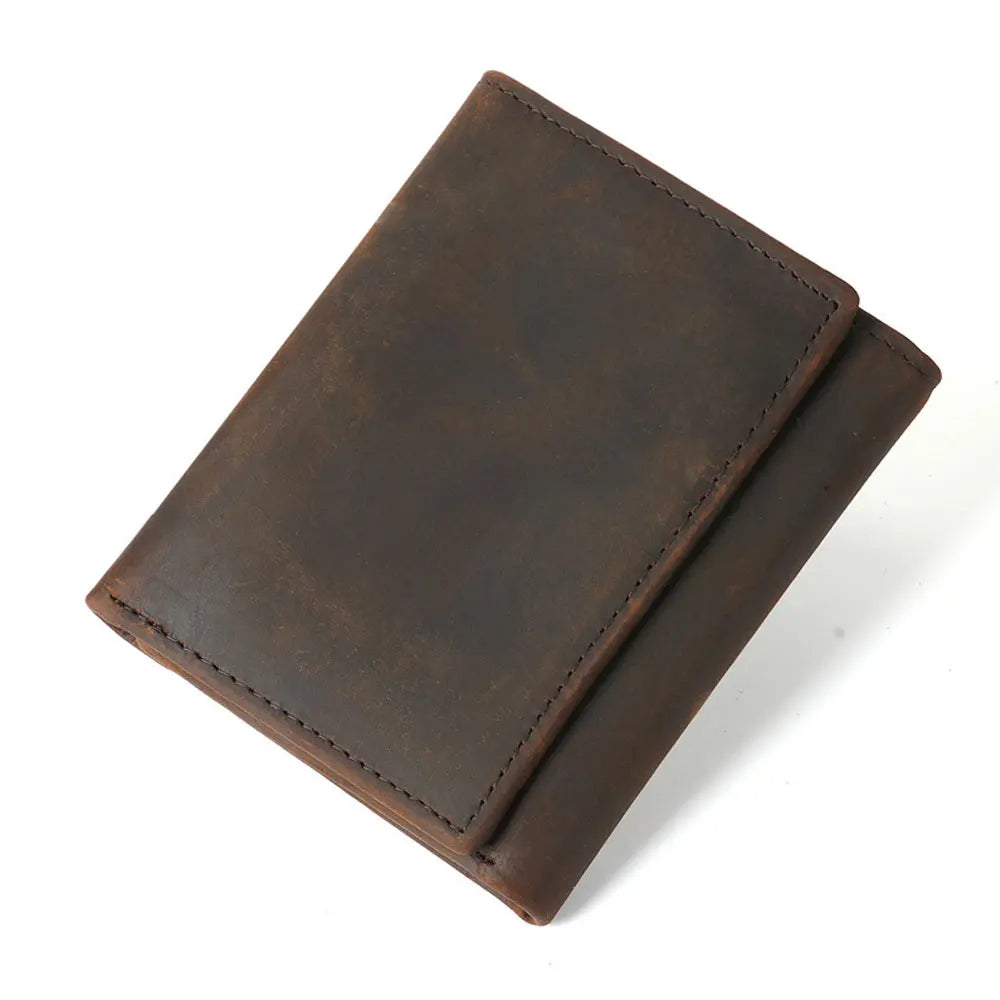 A dark brown genuine leather trifold wallet with a stitched edge shown at an angle.