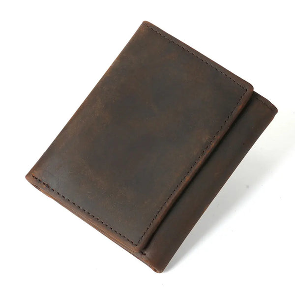 A dark brown genuine leather trifold wallet with a stitched edge shown at an angle.