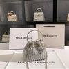 Silver crystal-embellished evening clutch with a chain displayed on a white surface.