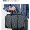 A person holds a dark gray executive PU leather laptop briefcase with a shoulder strap.