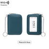 A dark teal RFID protected accordion wallet with a silver chain, shown in a close-up view.