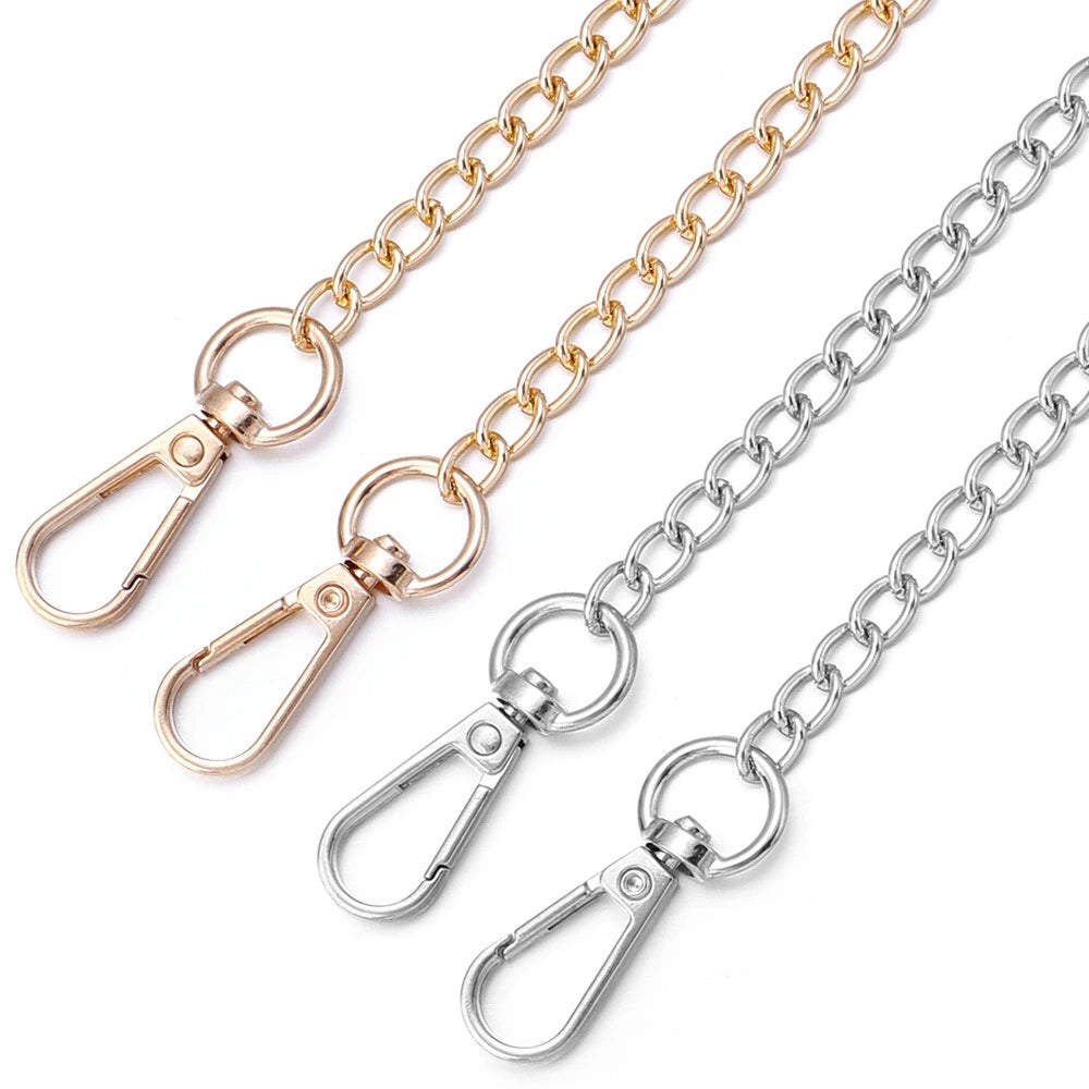 Gold and silver adjustable purse chain straps displayed diagonally against a white background.