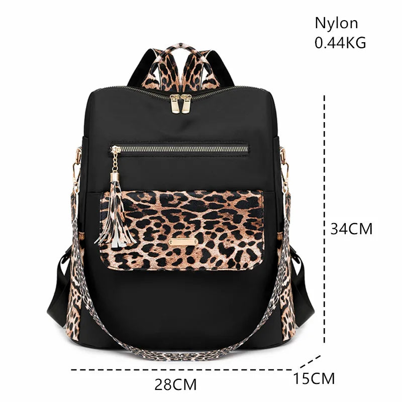 Black nylon leopard print fashion backpack with gold hardware and adjustable straps