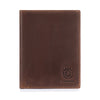 A dark brown genuine leather passport and travel wallet with a stitched edge and a lion emblem.