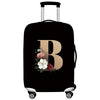 Black luggage with a gold letter B design and silver handle
