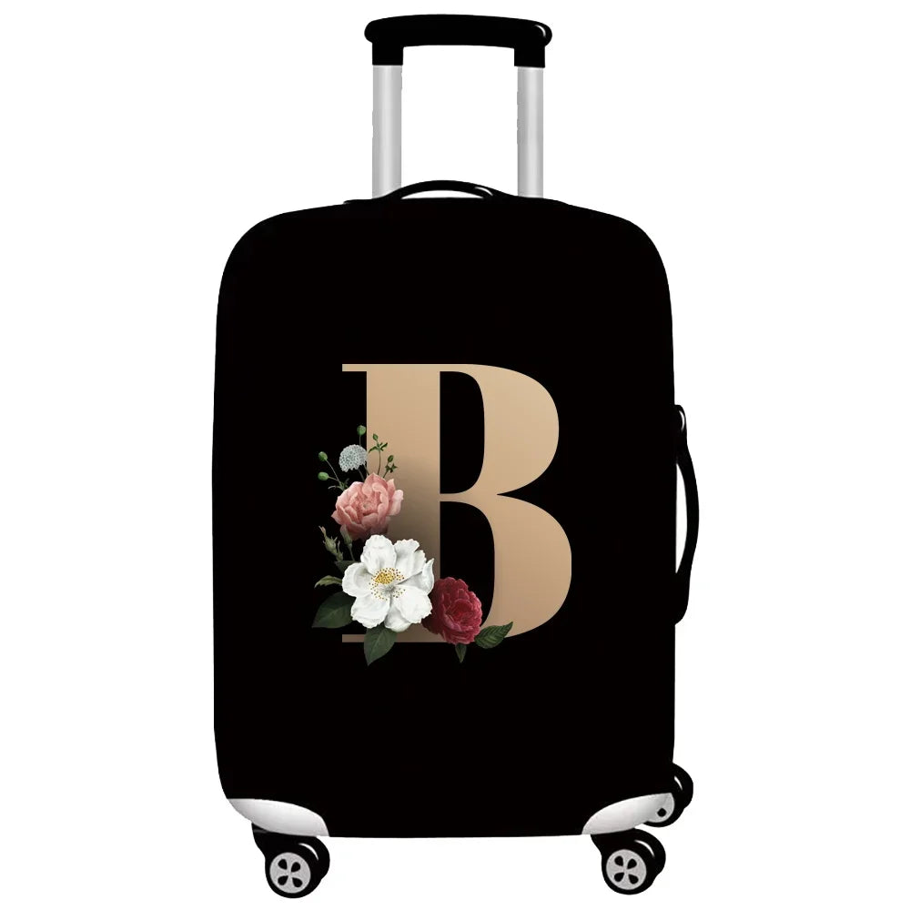 Black luggage with a gold letter B design and silver handle