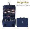 Navy blue waterproof makeup organizer and travel pouch with a clear interior and a separate zippered compartment.