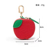 Red apple shaped PU leather coin purse keychain with gold-colored hook and green leaf detail