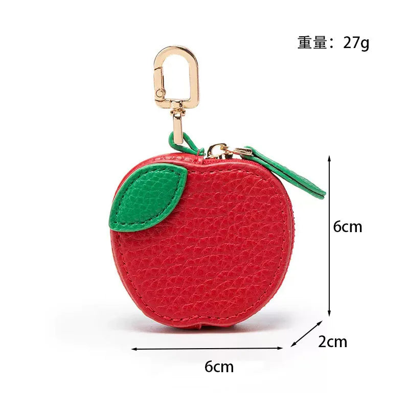 Red apple shaped PU leather coin purse keychain with gold-colored hook and green leaf detail
