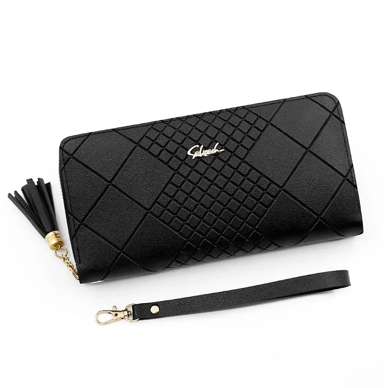 Black quilted clutch wallet with gold tassel and leather strap