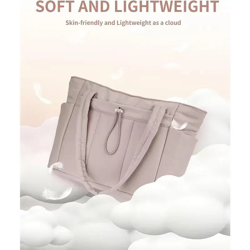 A light pink quilted tote bag is shown against a white cloud background.