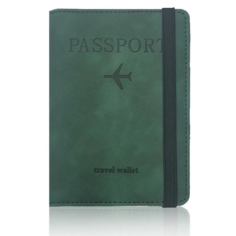 A dark green leather passport wallet with a black strap and a silver airplane emblem.