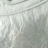 Close-up of a light gray soft PU leather shoulder tote bag with stitched detailing.