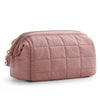 A mauve padded makeup bag with a wide-open design and gold zipper detail.