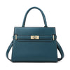 A dark teal leather handbag with gold hardware and a curved handle.