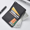 A black slim faux leather business card wallet is shown open, displaying several stacks of cash and various cards.
