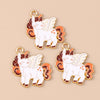 Two gold-colored charm pendants shaped like white unicorn horses with orange and brown accents.