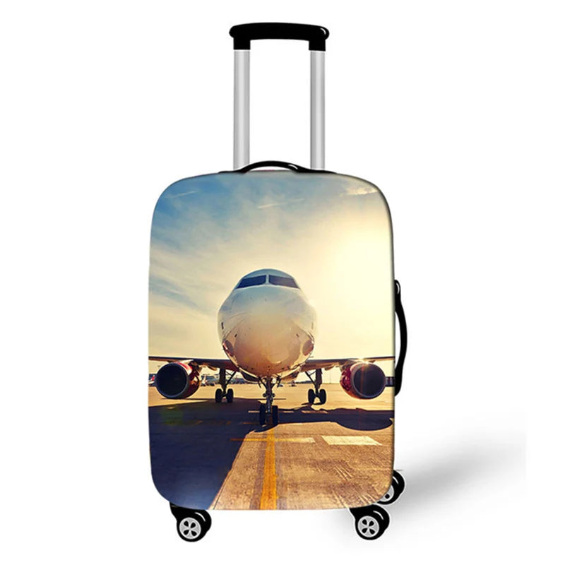 A silver suitcase with a protective cover featuring a bright sunset sky and clouds.
