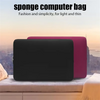 A black laptop is placed inside a pink sponge computer bag on a light surface.