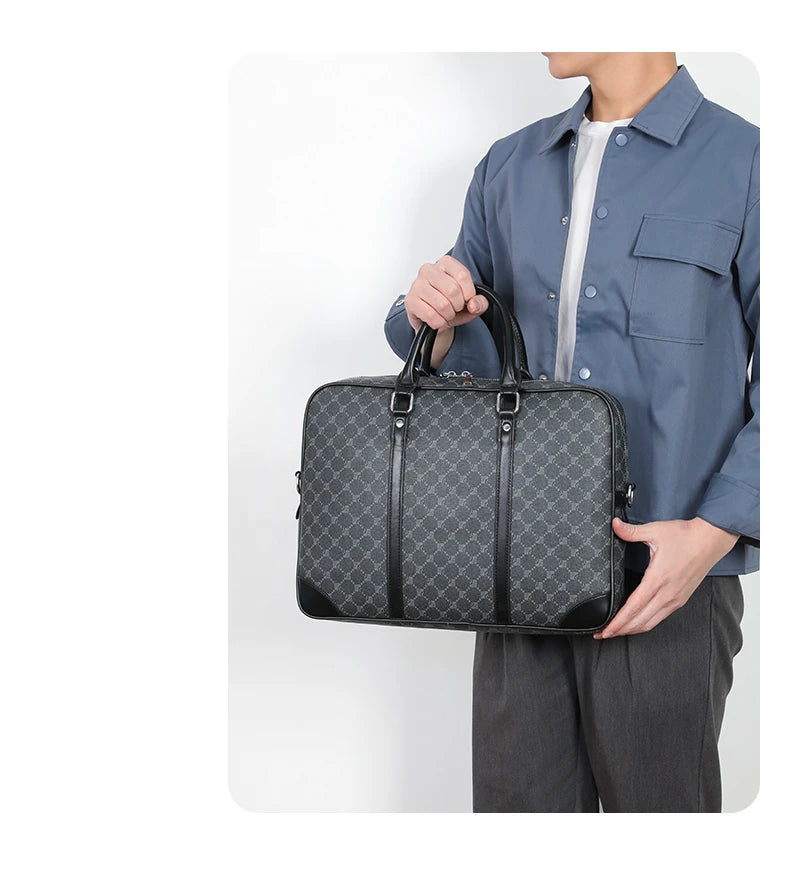 A person holds a dark gray executive PU leather laptop briefcase with a shoulder strap.