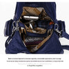 A dark blue PU leather hobo shoulder bag is shown open, displaying interior organization and lining.